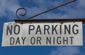 No parking day or night on hanging sign