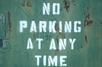 No parking on green metal surface 